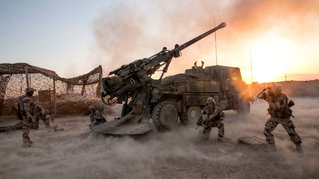French soldiers fire a mortar during operations in Iraq.