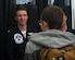 U.S. Air Force Capt. Will Graeff, Thunderbirds number 2 jet pilot speaks with a student of Denbigh High School Aviation Academy during career week at Newport News, Virginia, May 18, 2018.