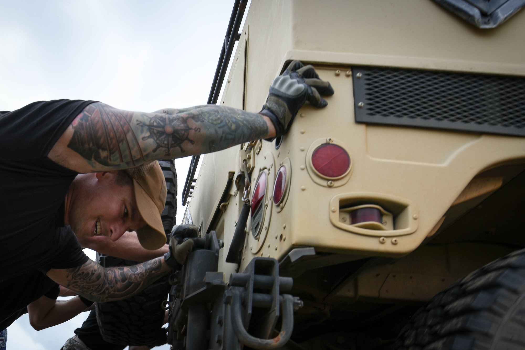 U.S. Air Force Staff Sgt. Patrick Formiller, 20th Security Forces Squadron flight sergeant, pushes a Humvee during the National Police Week Defenders Challenge at Shaw Air Force Base, S.C., May 15, 2018.