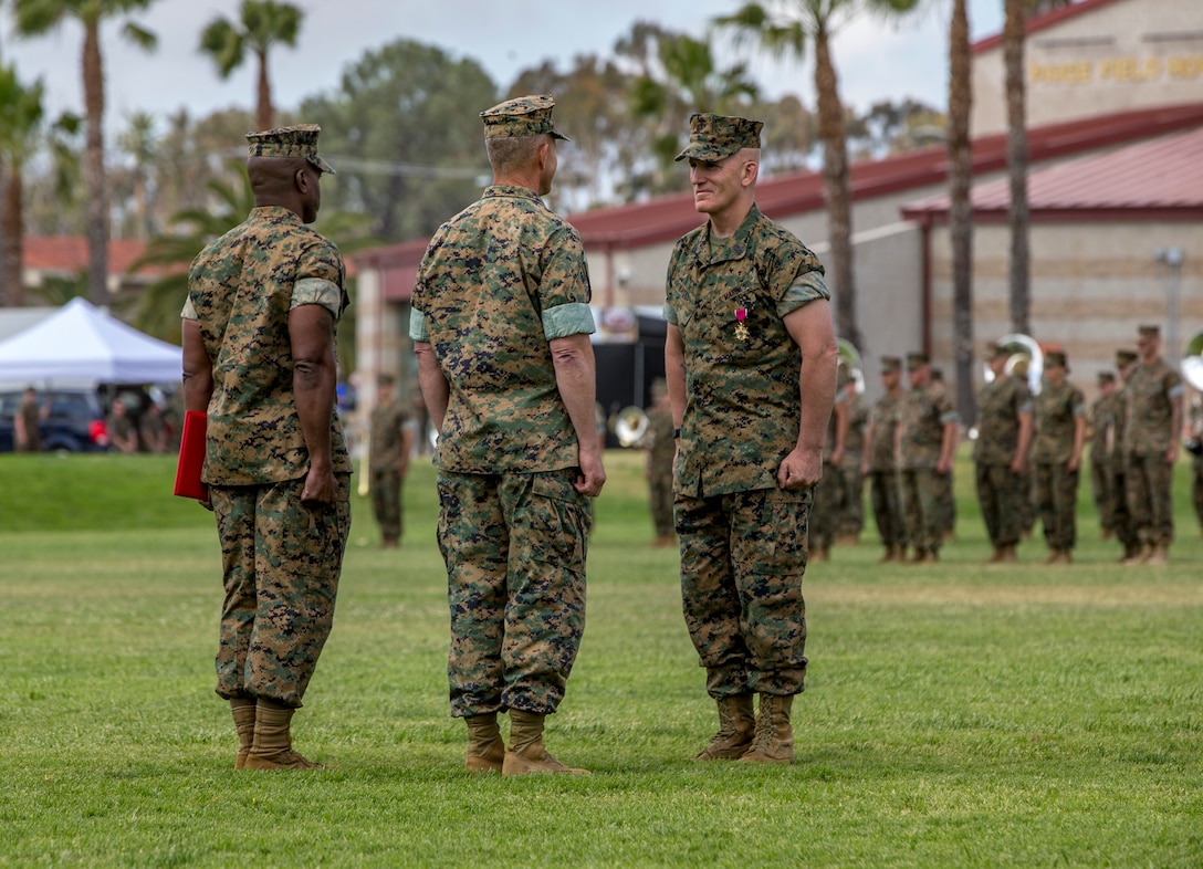 Lt. Gen. Lewis Craparotta, center, the I Marine Expeditionary Force commanding general, awards Sgt. Maj. Bradley Kasal, the outgoing I MEF sergeant major, the Legion of Merit during a relief and appointment ceremony on Camp Pendleton, Calif., May 18, 2018. Sgt. Maj. James Porterfield replaced Kasal as I MEF sergeant major. Kasal has served as I MEF sergeant major since 2015 and is retiring from the Marine Corps after 34 years of service. (U.S. Marine Corps photo by Lance Cpl. Clare Mcintire)