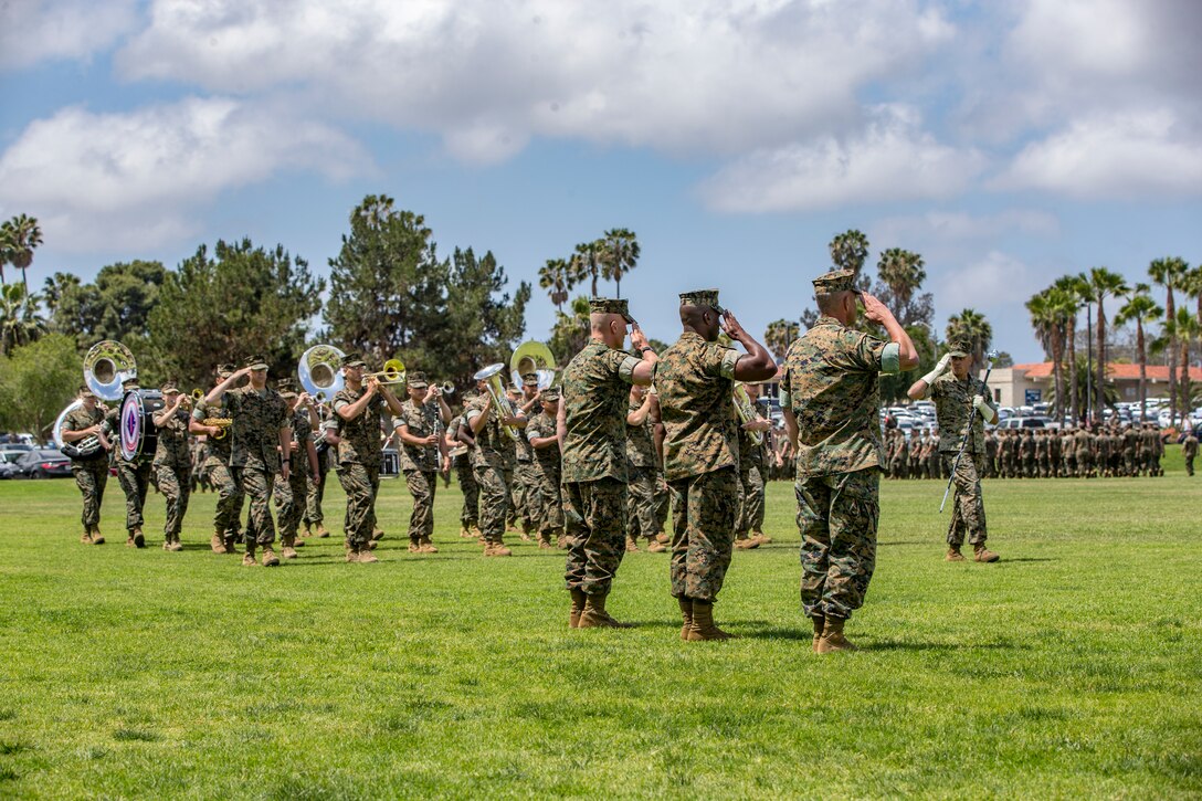 The 1st Marine Division Band marches by Sgt. Maj. Bradley Kasal, left, the outgoing I Marine Expeditionary Force sergeant major, Sgt. Maj. James Porterfield, center, the incoming I MEF sergeant major, and Lt. Gen. Lewis Craparotta, the I MEF commanding general, during a relief and appointment ceremony on Camp Pendleton, Calif., May 18, 2018. Porterfield replaced Kasal as I MEF sergeant major. Kasal has served as I MEF sergeant major since 2015 and is retiring from the Marine Corps after 34 years of service. (U.S. Marine Corps photo by Lance Cpl. Clare Mcintire)