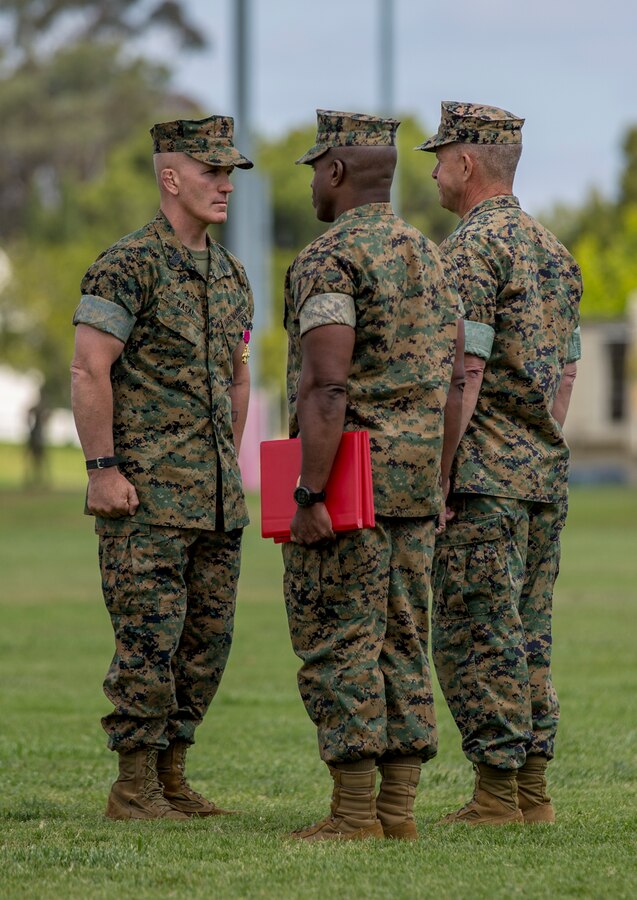 Lt. Gen. Lewis Craparotta, the I Marine Expeditionary Force commanding general, right, awards Sgt. Maj. Bradley Kasal, left, the outgoing I MEF sergeant major, the Legion of Merit during a relief and appointment ceremony on Camp Pendleton, Calif., May 18, 2018. Sgt. Maj. James Porterfield replaced Kasal as I MEF sergeant major. Kasal has served as I MEF sergeant major since 2015 and is retiring from the Marine Corps after 34 years of service. (U.S. Marine Corps photo by Cpl. Jacob Farbo)