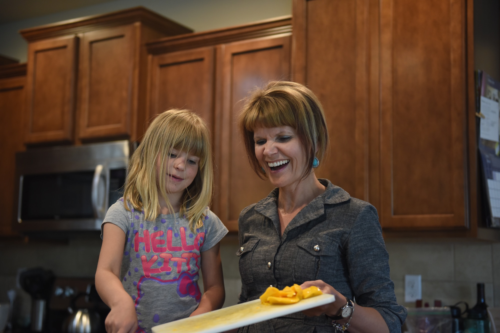 Jodi Novak, cancer survivor, cooks with her daughter Bethany May 14, 2018, in Parker, Colorado. Novak has two daughters, Bethany and Abigail Novak. (U.S. Air Force photo by Airman 1st Class Michael D. Mathews)