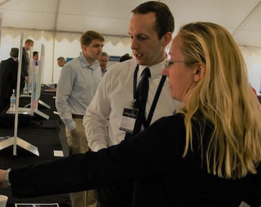 IMAGE: DAHLGREN, Va. (May 2, 2018) - A Department of the Navy innovator presents his technological project at the two-day 2018 Naval Innovative Science and Engineering (NISE) Technical Exchange Meeting held at Naval Surface Warfare Center Dahlgren Division. More than 150 NISE-funded innovations were presented to the Department of Defense technical leaders, scientists, and engineers who visited the Deputy Assistant Secretary of Defense for Research, Development, Test and Evaluation sponsored event to see and learn about the NISE projects and their alignment to naval systems and naval needs. (U.S. Navy photo/Released)