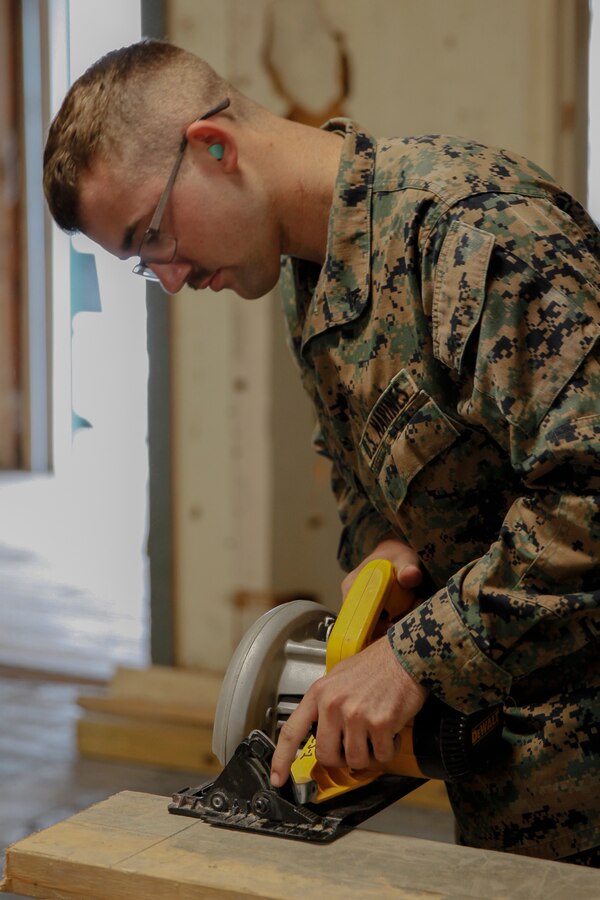 U.S. Marine Lance Cpl. Casey W. Holle, combat engineer with Engineer Company C, 6th Engineer Support Battalion, 4th Marine Logistics Group, practices using a circular saw power tool at a construction site during exercise Red Dagger at Fort Indiantown Gap, Pa., May 19, 2018. Exercise Red Dagger is a bilateral training exercise that gives Marines an opportunity to exchange tactics, techniques and procedures as well as build working relationships with their British counterparts. (U.S. Marine Corps photo by Sgt. Melanie Wolf/Released)