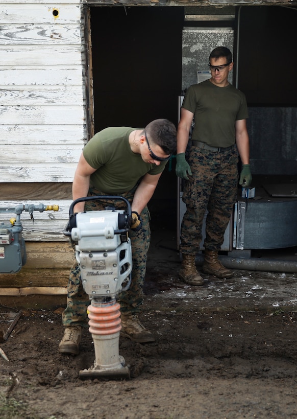 U.S. Marine Lance Cpl. Wyatt Miller, combat engineer with Engineer Company C, 6th Engineer Support Battalion, 4th Marine Logistics Group, operates a dirt compactor at a construction site during exercise Red Dagger at Fort Indiantown Gap, Pa., May 20, 2018.