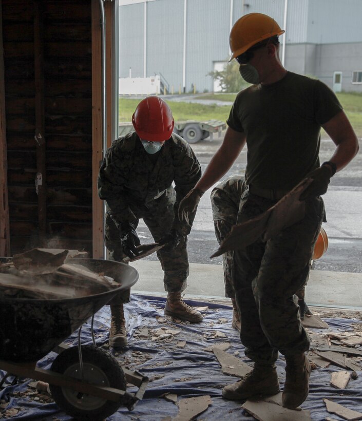 U.S. Marines with 6th Engineer Support Battalion, 4th Marine Logistics Group, gather old pieces dry wood at a construction site during exercise Red Dagger at Fort Indiantown Gap, Pa., May 20, 2018.