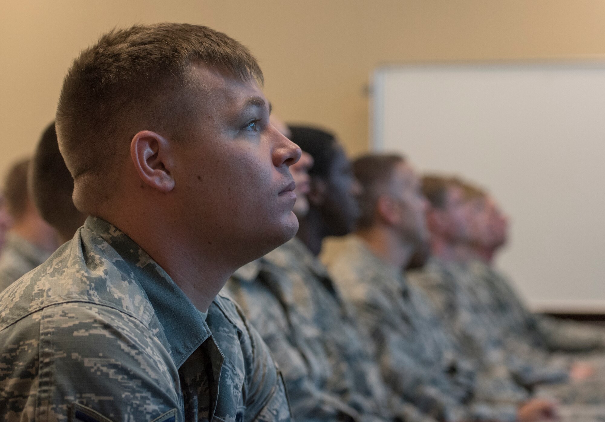 An Airman from the 33rd Aircraft Maintenance Squadron listens during an Operational Safety Review briefing May 18, 2018, at Eglin Air Force Base, Fla. The Operational Safety Review was briefed in a large forum and then broken down into smaller groups for open discussion. (U.S. Air Force photo by Airman 1st Class Emily Smallwood)