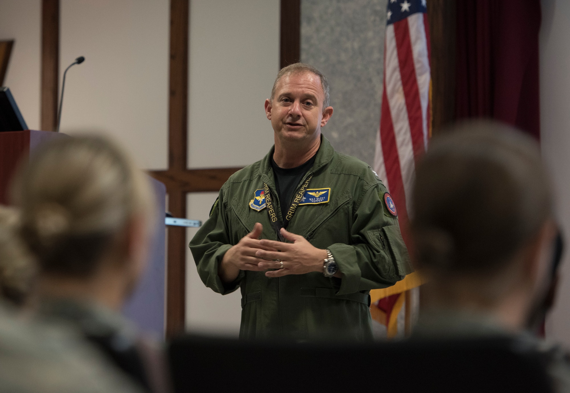 U.S. Navy Capt. Max McCoy, 33rd Fighter Wing vice commander, speaks to members of the 33 FW during the Operational Safety Review May 18, 2018, at Eglin Air Force Base, Fla. During the discussion, McCoy stressed the importance of not making the one day about safety, but using the discussions to ensure we are using professionalism, asking the right questions and using operational risk management every day. (U.S. Air Force photo by Staff Sgt. Peter Thompson)