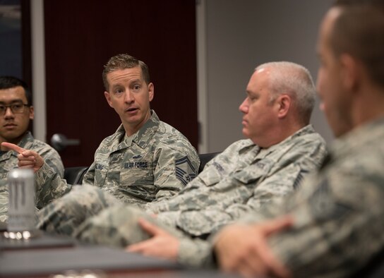 U.S. Air Force Senior Master Sgt. Joshua Wessling, 33rd Fighter Wing Wing Staff Agency superintendent, center, speak with members of the WSA during a small group meeting May 18, 2018, at Eglin Air Force Base, Fla. Members of the 33 FW separated into small groups to conduct a safety review of processes and procedures. (U.S. Air Force photo by Staff Sgt. Peter Thompson)