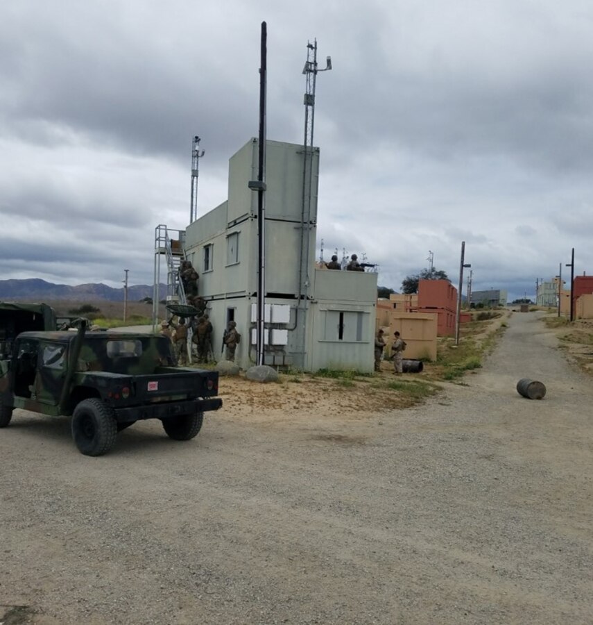 Marines of Transmissions Platoon, Company A maintain security and establish radio nets and links after securing their objective.  Members of the Exercise Support Group handled a majority of administrative and logistical requirements and provided an opposition force (OPFOR) throughout the exercise.