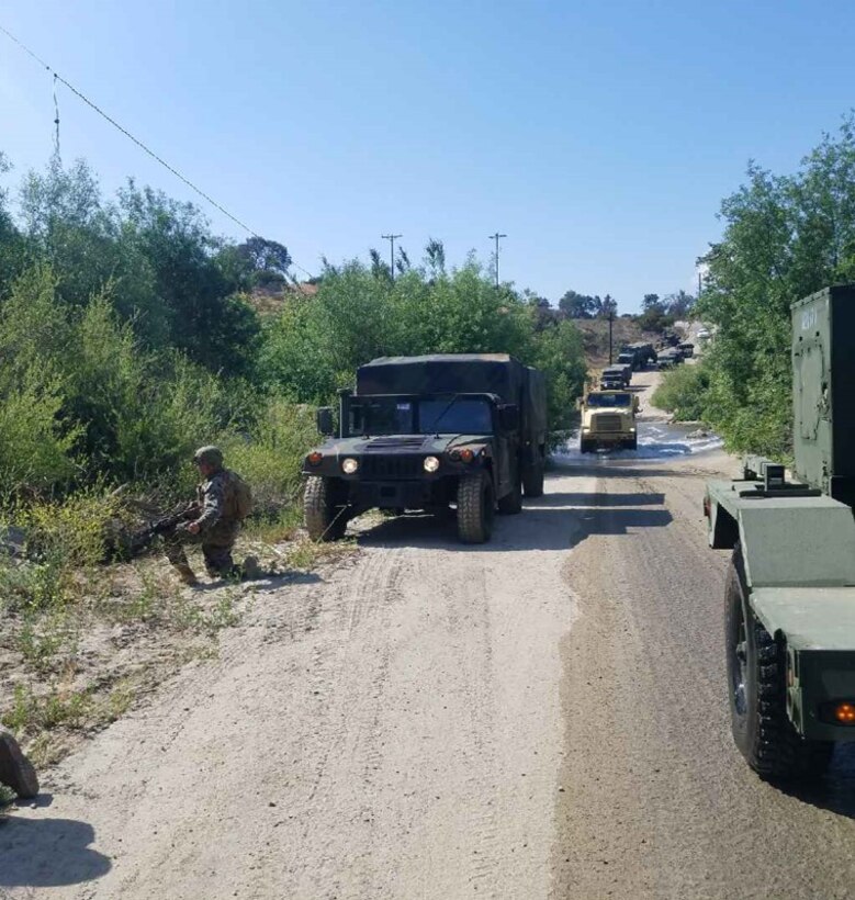 Forward Detachment of Transmissions Platoon, Company A provide far side security during a river crossing. Motor Transport operators attached to the Exercise Support Group developed TTPs for convoy operations.