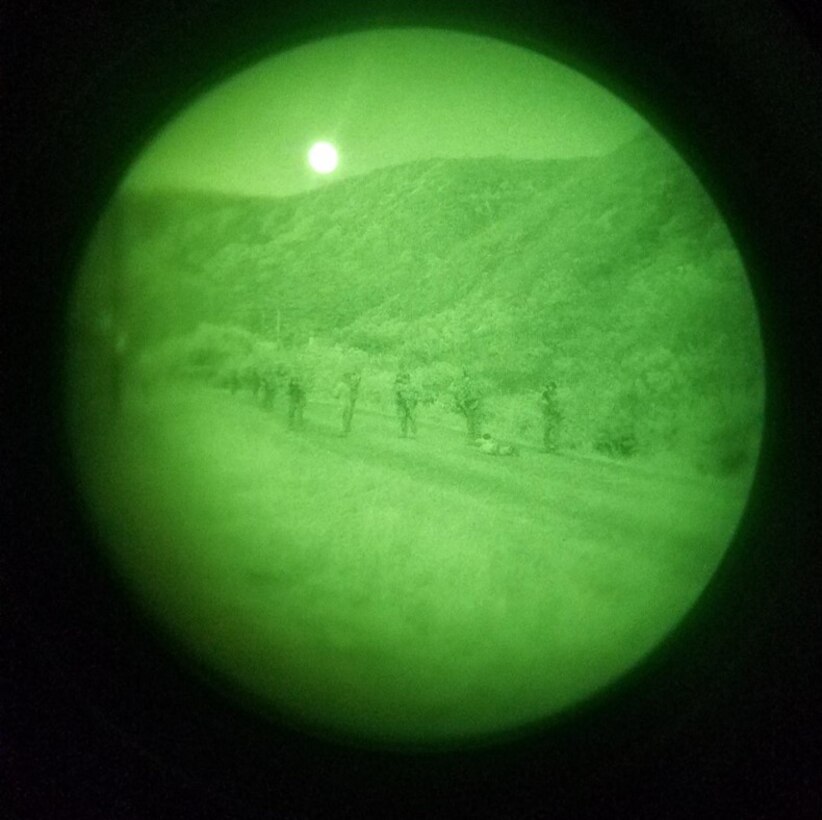 Marines of Transmissions Platoon, Company A search and detain an enemy POW during a dismounted contact patrol to assist set up of radio nets with an adjacent unit.