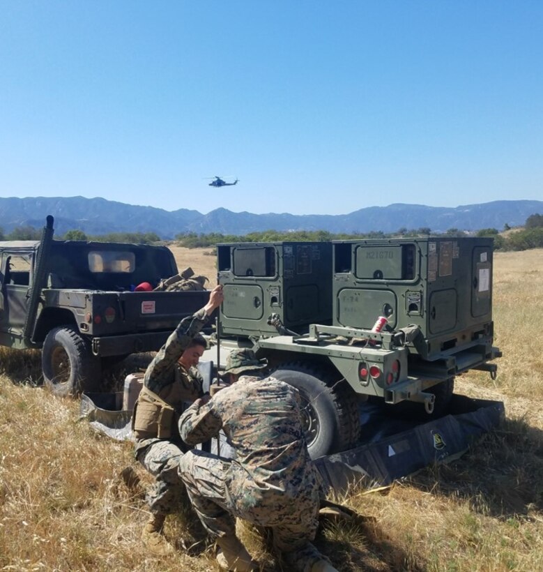 Utilities Marines attached to Transmissions Platoon, Company A establish a tactical power grid for the Main Detachment at their objective.  Utility Marines were able to establish the power grid rapidly, which significantly decreased the time needed to establish radio communications.