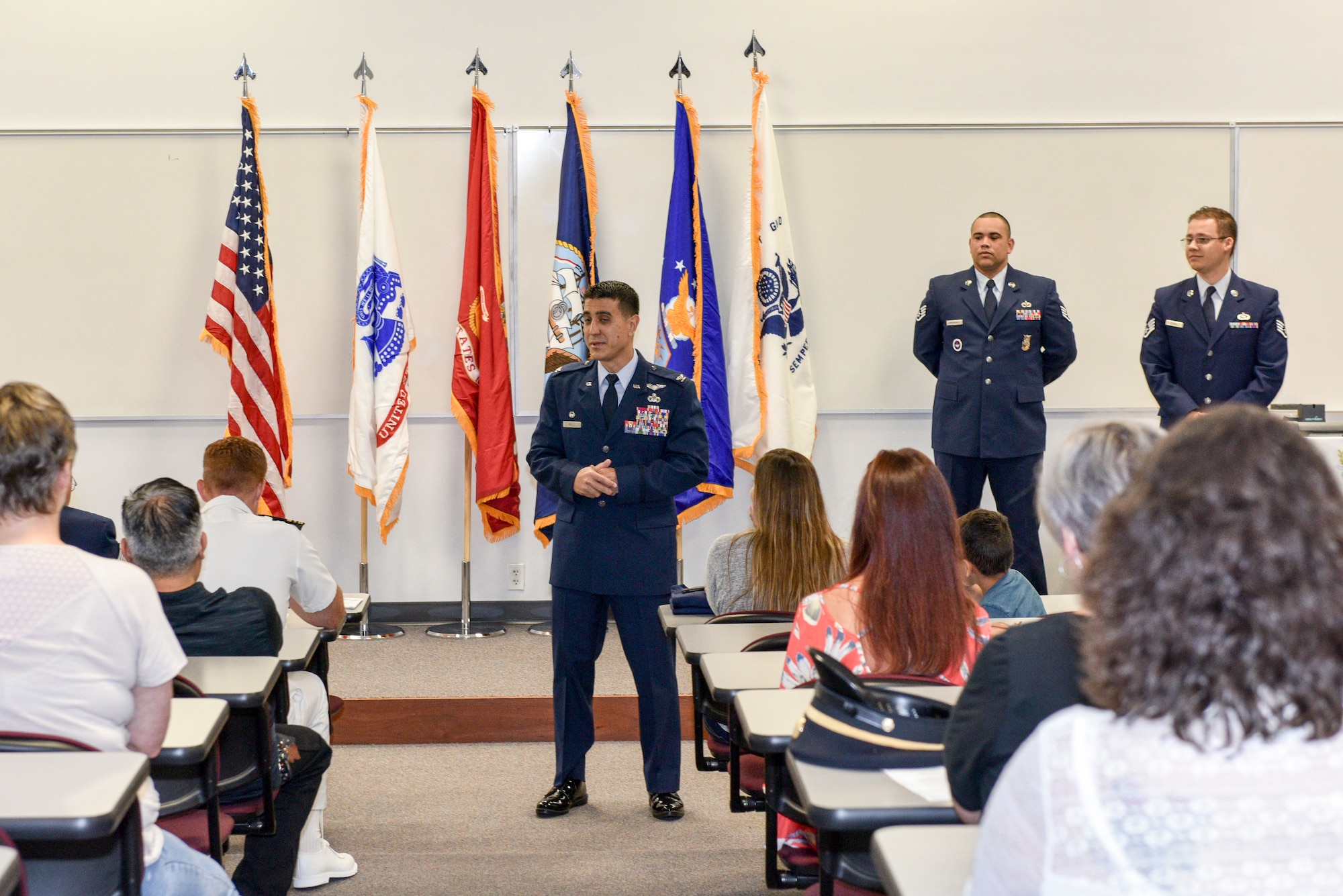 U.S. Air Force Col. Ricky Mills, 17th Training Wing commander, speaks to high school enlistees and their families during the Our Community Salutes ceremony, San Angelo, Texas, May 19, 2018. OCS was established in 2009 as a non-profit organization helping communities recognize, honor and support high school seniors who enlisted in the U.S. armed services after graduation. (U.S. Air Force photo by Senior Airman Randall Moose/Released)