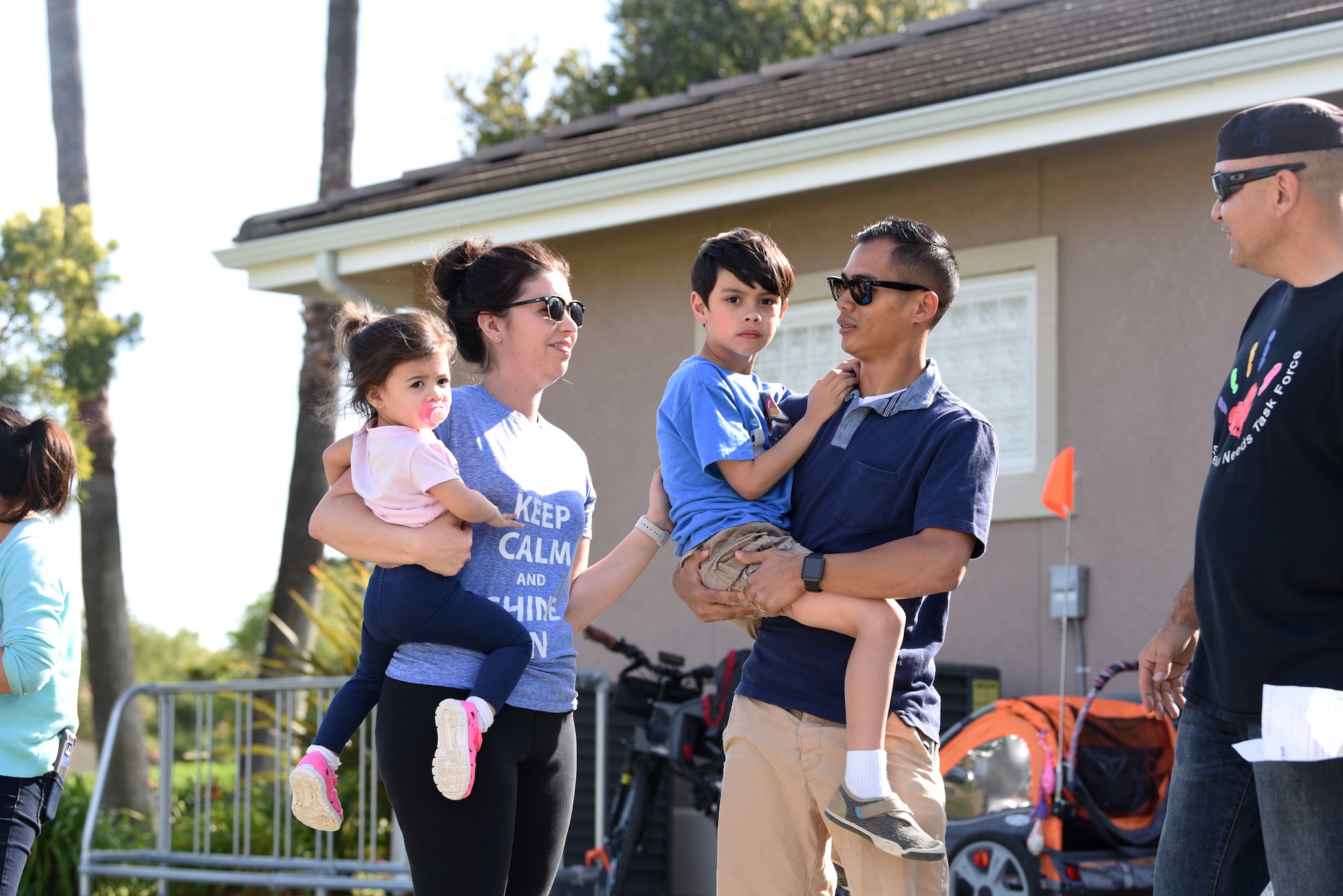U.S. Air Force Tech. Sgt. Peter Amaro, 60th Logistic Readiness Squadron, holds his son May 18, 2018, at the Balfour Beatty building at Travis Air Force Base, Calif. Landric Amaro, diagnosed with autism at the age of three, received an applause with his family for having blue lights outside of their home, which signifies autism awareness. (U.S. Air Force photo by Airman 1st Class Jonathon D. A. Carnell)