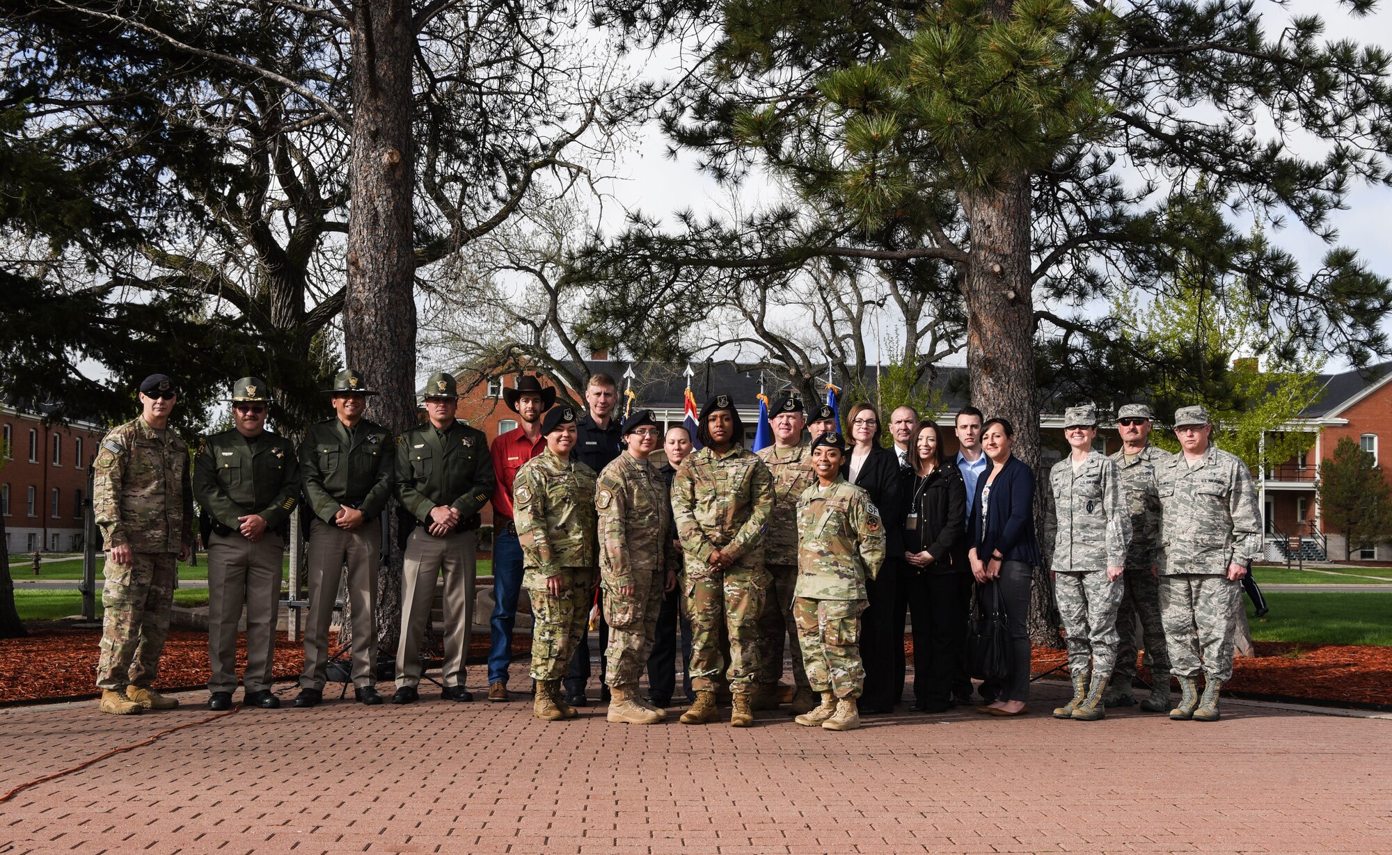 90th Missile Wing Leadership pose for a photo with Security Forces Defenders and local Cheyenne police officers for the opening of Police Week, May 14, 2018, on F.E Warren Air Force Base, Wyo. In 1962, President John F. Kennedy signed a proclamation which designated May 15 as Peace Officers Memorial Day and the week in which that date falls as Police Week. People all across the United States participate in various events which honor those who have paid the ultimate sacrifice. (U.S. Air Force photo by Airman 1st Class Braydon Williams)