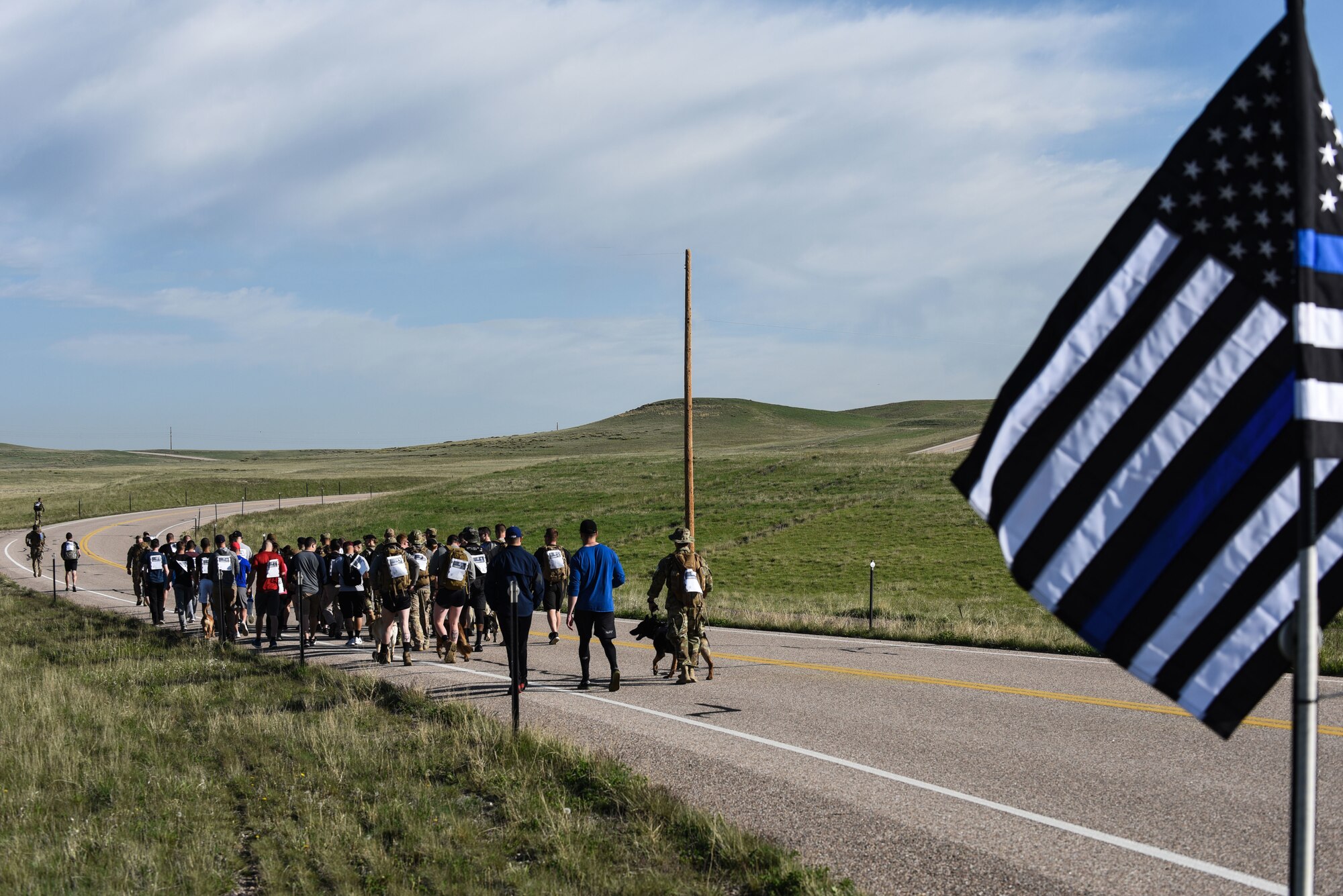 Airmen from the 90th Missile Wing begin the run, walk or ruck for Police Week, May 17, 2018, on F.E. Warren Air Force Base, Wyo. The Police Week run, walk or ruck was a six-mile course around the northern perimeter of the base. To place in the competition each Airmen’s ruck had to weigh 35 pounds. In 1962, President John F. Kennedy signed a proclamation which designated May 15 as Peace Officers Memorial Day and the week in which that date falls as Police Week. People all across the United States participate in various events which honor those who have paid the ultimate sacrifice. (U.S. Air Force photo by Airman 1st Class Braydon Williams)