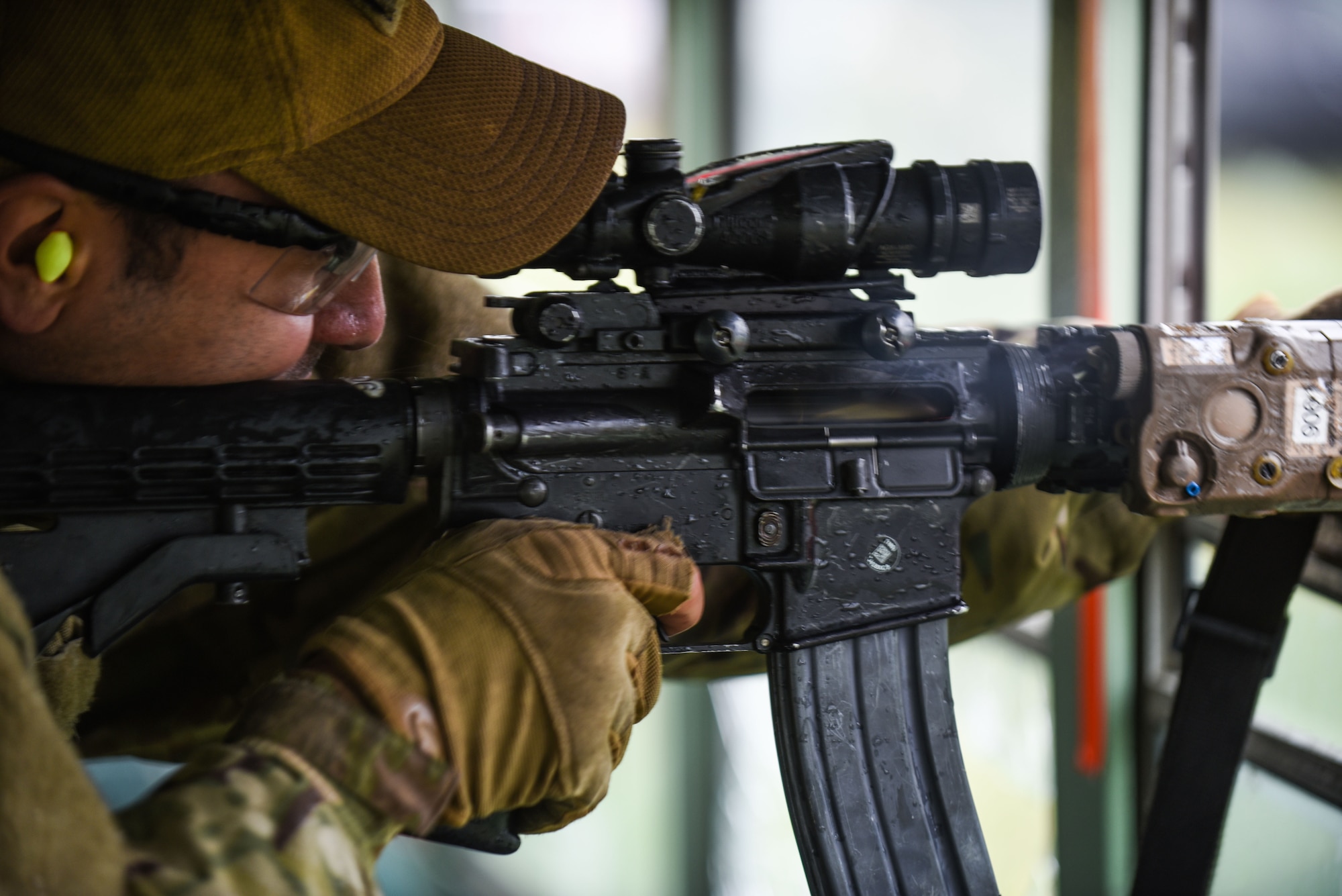 Senior Airman Kevin Santos 90th Security Forces Squadron military working dog handler, fires his weapon down-range during a three-gun competition at the Cheyenne Police Department firing range in Laramie County, Wyo. A three-gun competition consists of a set of courses in which you shoot three different weapons—a rifle, a pistol and a shotgun—at different stages, and engage various short- and long-distance targets from multiple positions. Scoring is based on time and hits minus penalties, with each stage assigned match points based on a degree of difficulty. In 1962, President John F. Kennedy signed a proclamation which designated May 15 as Peace Officers Memorial Day and the week in which that date falls as Police Week. People all across the United States participate in various events which honor those who have paid the ultimate sacrifice. (U.S. Air Force photo by Airman 1st Class Braydon Williams)