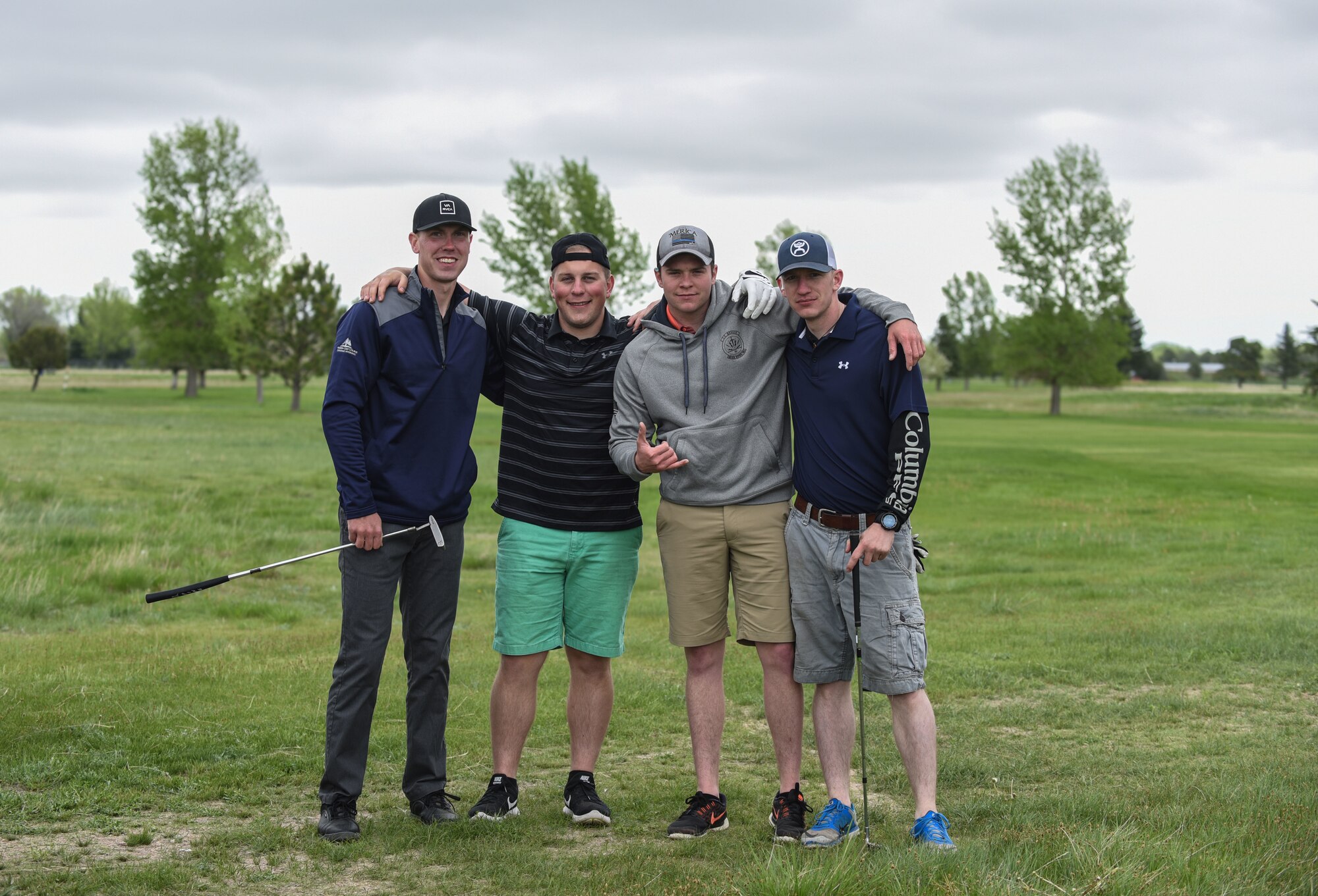 A four-man golf team from the 90th Tactical Response Force, pose for a group photo during the Police Week Security Forces golf tournament, May 18, 2018, on F.E. Warren Air Force Base, Wyo. Teams came out for a relaxed round of golf to end Police Week with a good time. In 1962, President John F. Kennedy signed a proclamation which designated May 15 as Peace Officers Memorial Day and the week in which that date falls as Police Week. People all across the United States participate in various events which honor those who have paid the ultimate sacrifice. (U.S. Air Force photo by Airman 1st Class Braydon Williams)