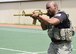 U.S. Air Force Tech. Sgt. Hector Rivera Bonilla, 51st Security Forces Squadron member, performs a duck walk during a relay race at Osan Air Base, Republic of Korea, May 15, 2018. The relay race was hosted by the 51st Security Forces Squadron and was a part of the National Police Week 2018 events. The relay consisted of teams of performing various physical activities that mirror those of security forces training. (U.S. Air Force photo by Airman 1st Class Ilyana A. Escalona)