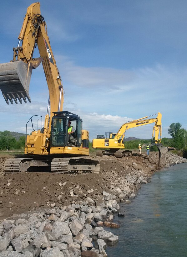 The Corps awarded the emergency repair contract May 18 to help Jefferson County emergency managers and Flood Control District #1 stabilize an eroded area of the Heise-Roberts Levee System on the Snake River near Lorenzo, Idaho. As of Monday morning (May 21), contractors have repaired more than two-thirds of the 300-feet-long by 15-feet-wide section of levee that was eroded away by seasonal high flows in the Snake River. In some locations the levee has been eroded more than 20 feet in height from the top of the levee -- about 8 feet of the levee is visible above the water’s surface. If not repaired, the erosion poses a threat to the structural integrity of the levee and about 65 homes located within the leveed area.