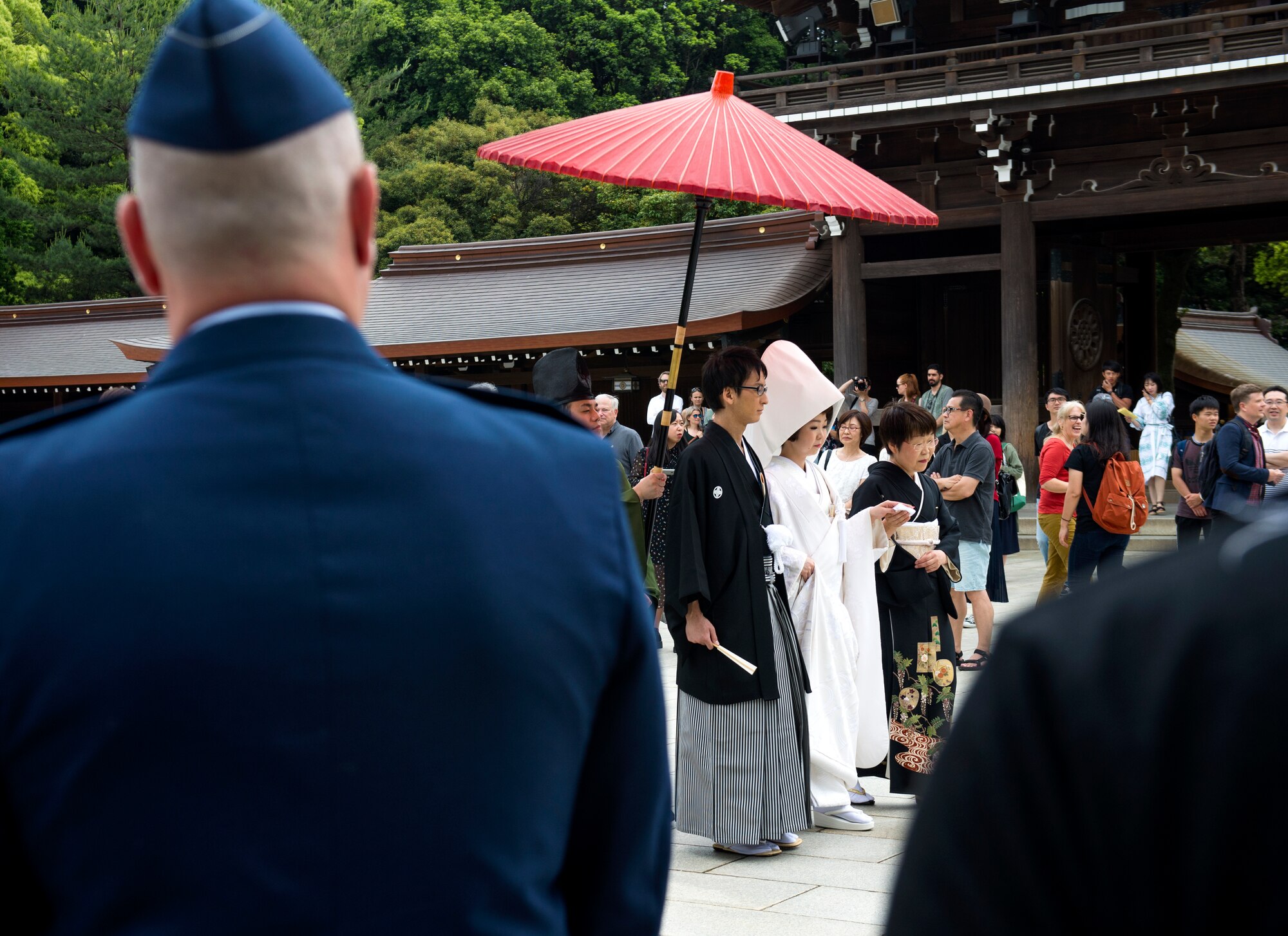 Lt. Col. James A. Cunningham, 374th Wing Staff Agencies commander, watches a Japanese wedding procession