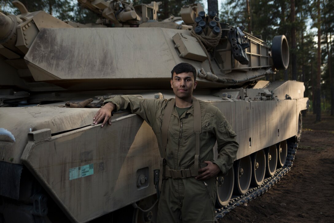 Lance Cpl. Angel Delgado from Bravo Company, 4th Tanks Battalion, is a tank loader for this M1A1 tank during his participation in Exercise Arrow 18 in Pohjankangas Training Area, near Kankaanpaa, Finland, May 16, 2018. Exercise Arrow is an annual Finnish multi-national exercise with the purpose of training with mechanized infantry, artillery, and mortar field training skills in a live-fire exercise. This is the first year the Marine Corps is participating in this exercise and the first time the M1A1 Abrams tanks have been in Finland. (U.S. Marine Corps photo by Sgt. Averi Coppa/Released)