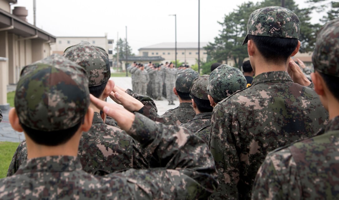 Members of the 8th Security Forces Squadron, retires a U.S. Flag during a retreat ceremony May 18, 2017, at Kunsan Air Base, Republic of Korea. The ceremony was the last official event, ending National Police Week at Kunsan. (U.S. Air Force photo by Senior Airman Colby L. Hardin)