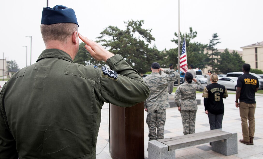 Members of the 8th Security Forces Squadron, retires a U.S. Flag during a retreat ceremony May 18, 2017, at Kunsan Air Base, Republic of Korea. The ceremony was the last official event, ending National Police Week at Kunsan. (U.S. Air Force photo by Senior Airman Colby L. Hardin)