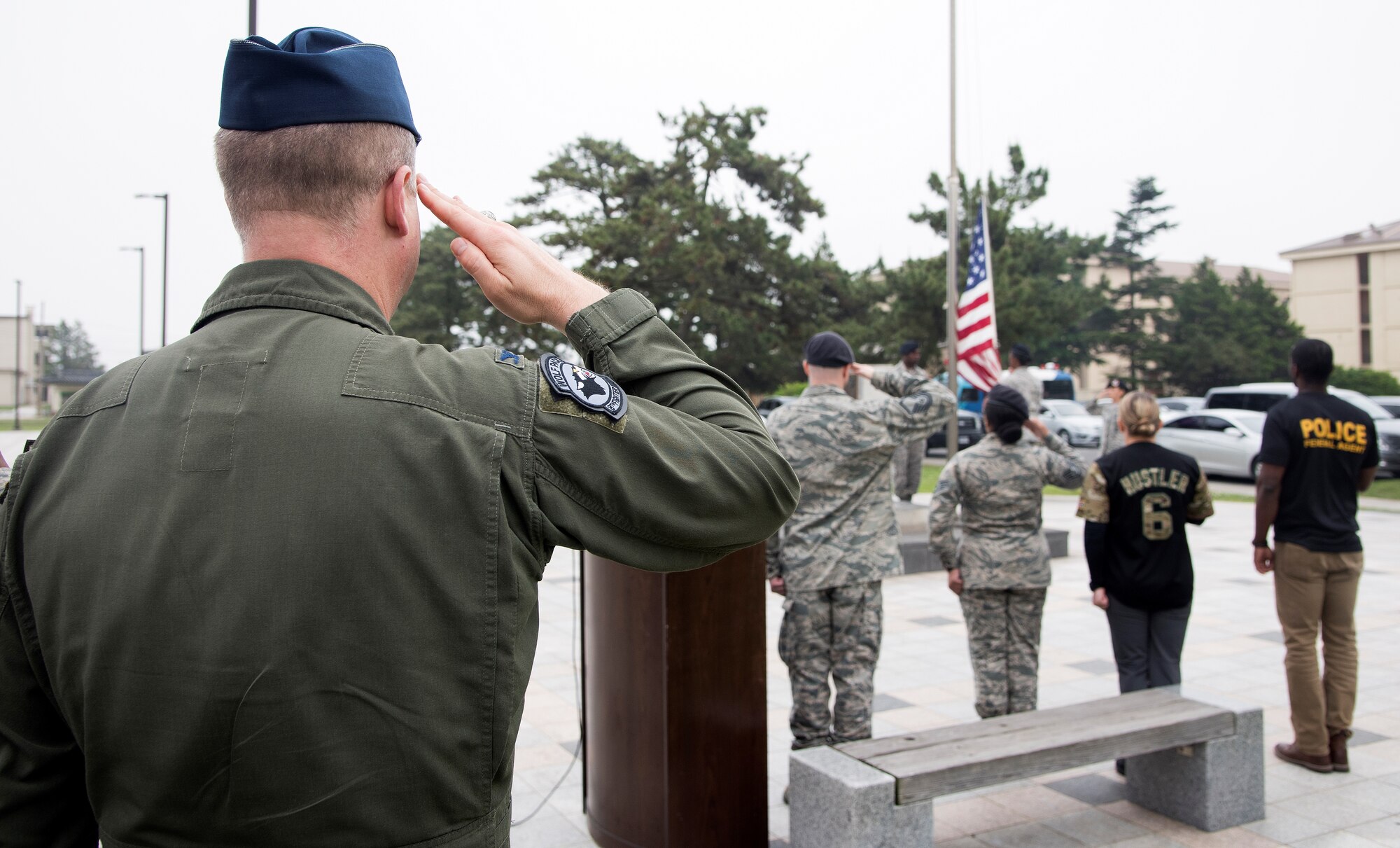Members of the 8th Security Forces Squadron, retires a U.S. Flag during a retreat ceremony May 18, 2017, at Kunsan Air Base, Republic of Korea. The ceremony was the last official event, ending National Police Week at Kunsan. (U.S. Air Force photo by Senior Airman Colby L. Hardin)