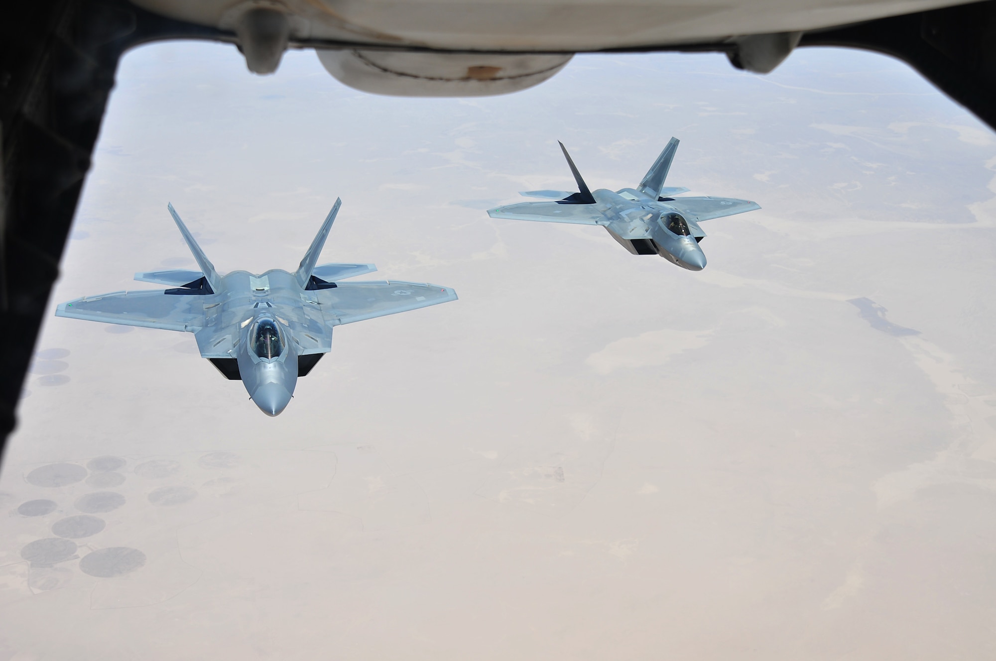 Two F-22 Raptors assigned to the 94th Fighter Squadron at the 380th Air Expeditionary Wing, Al Dhafra Air Base, support Operation Inherent Resolve over the skies of Southwest Asia, May 16, 2018. The Raptor’s mission is to help ensure that the operations of U.S. and coalition forces on the ground and in the air are unimpeded by adversary aircraft.