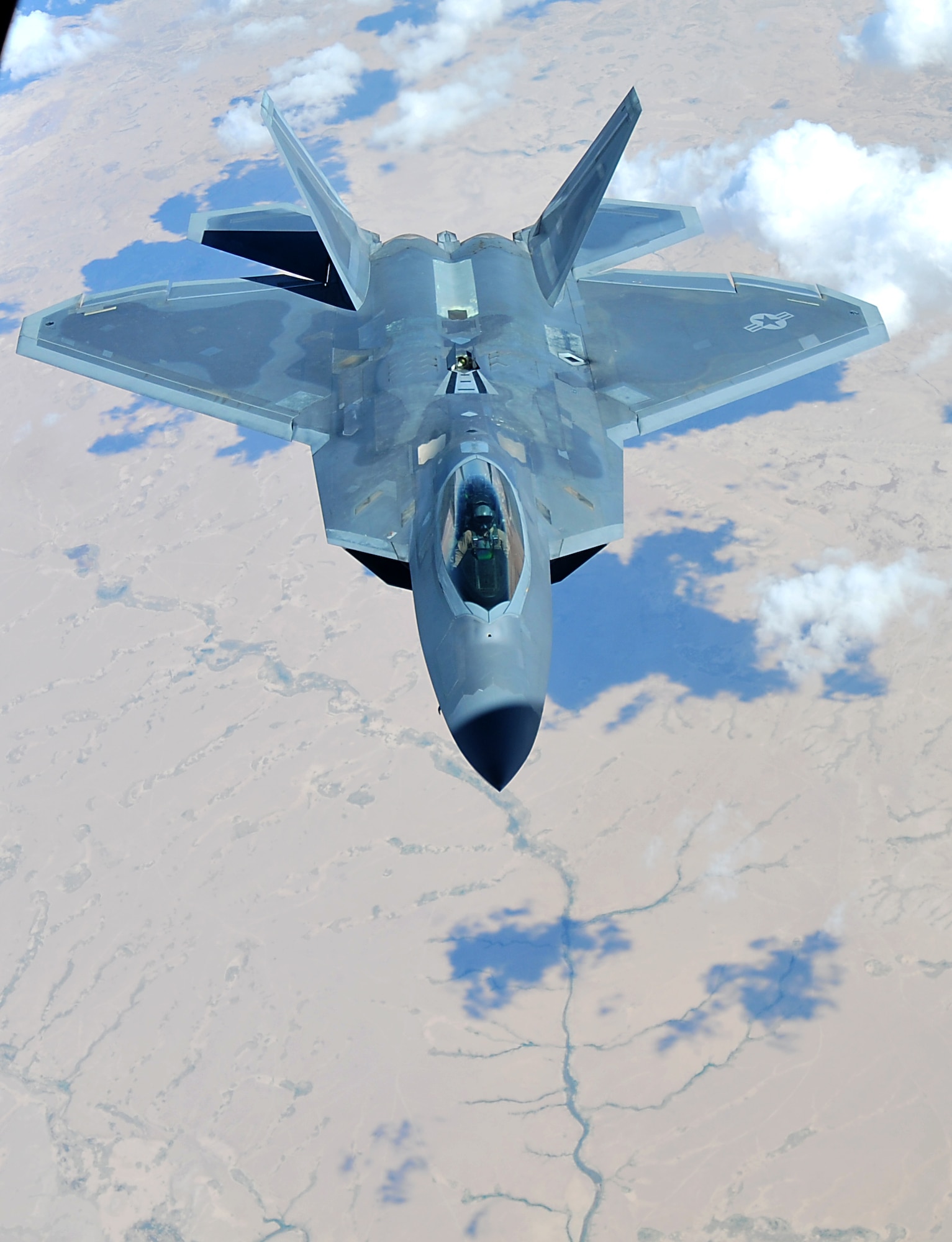 A F-22 Raptor assigned to the 94th Fighter Squadron at the 380th Air Expeditionary Wing, Al Dhafra Air Base, supports Operation Inherent Resolve over the skies of Southwest Asia, May 16, 2018. The Raptor’s mission is to help ensure that the operations of U.S. and coalition forces on the ground and in the air are unimpeded by adversary aircraft.