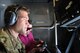 Tech. Sgt. Adam Sigman, 908th KC-10 Extender inflight refueling specialist refuels a 94th Fighter Squadron F-22 raptor while Combat Aircraft Magazine editor and Journalist, Jamie Hunter, reviews photos.