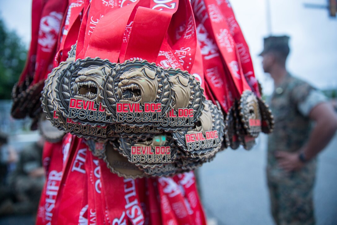 Medals for the Devil Dog Double race of the 11th Annual Marine Corps Historic Half run are displayed at the finish line in Fredericksburg, Va., May 20, 2018. Runners of the Devil Dog Double “go for two” and scale Hospital Hill twice by participating in both the five mile Semper 5ive race and then the 13.1 mile Historic Half.