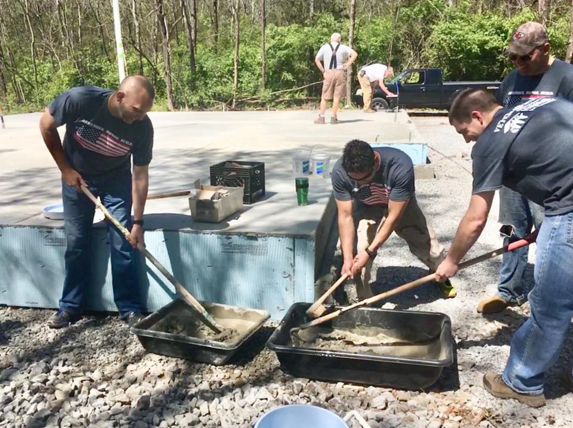 From left, 2nd Lt. Jonathan Teer, Capt. Michael Davault, 2nd Lt. Ryan Boudreaux and 1st Lt. Adam McKenzie, members of the Arnold Air Force Base Company Grade Officer Council, mix mortar at one of the homes at which they worked. Members of the CGOC recently volunteered with Rutherford County Area Habitat for Humanity and worked on two homes the Habitat is constructing in the area.