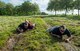 U.S. Air Force Tech. Sgt. Smith and Staff Sgt. Clark, 422nd Security Forces Squadron, low crawl through a mud trail at RAF Croughton, May 18, 2018. The low crawl exercise was part of the 2018 police week relay race that had over 10 teams participating. (U.S. Air Force photo by Senior Airman Chase Sousa)