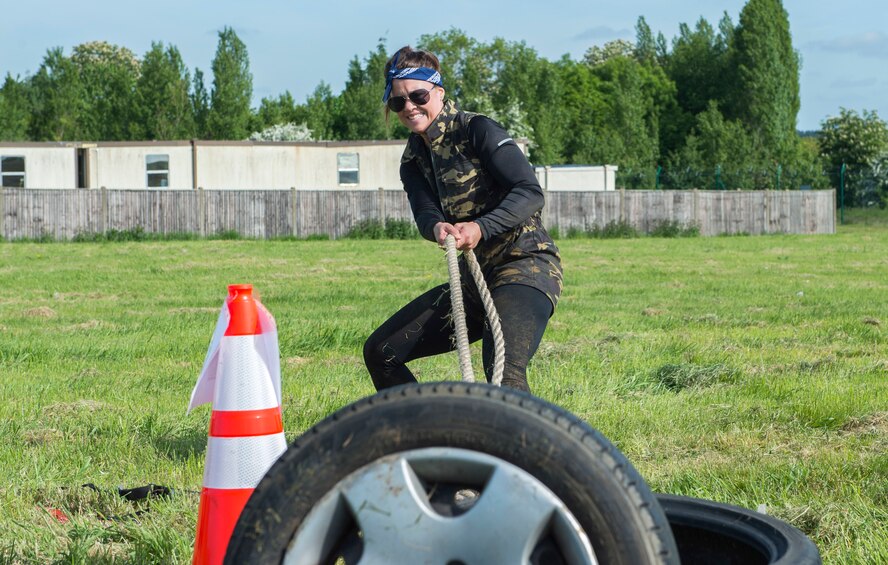 Becca Clark pulls a rope tied to three tires as part of the 2018 Police week challenge at RAF Croughton, May 18, 2018. The challenge consisted of 10 stations where contestants had to do various activities like assembling an m4 rifle and carrying ammo cans. (U.S. Air Force photo by Senior Airman Chase Sousa)