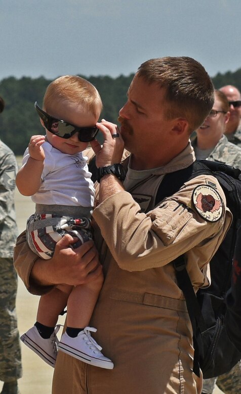 A U.S. Airman places his sunglasses on his son at Shaw Air Force Base, S.C., May 6, 2018 after returning from a six-month deployment to Afghanistan.