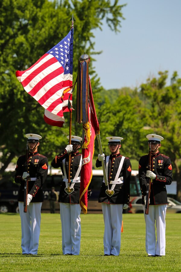The U.S. Marine Corps Color Guard presents the National Ensign and the U.S. Marine Corps Colors during a Battle Color Ceremony as a part of the U.S. Naval Academy Commissioning Week at the USNA, Annapolis, MD, May 21, 2018. Parents, family members and guests of the First Class Midshipmen were invited to attend a series of events, including the BCD, in honor of the graduates. (Official Marine Corps photo by Cpl. Damon Mclean/Released)