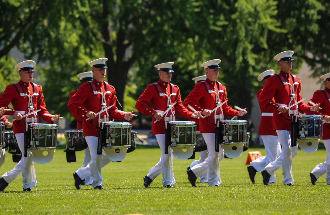 Master Sgt. Keith Martinez, assistant drum major, “The Commandant’s Own” U.S. Marine Drum & Bugle Corps, renders a salute during a Battle Color Ceremony as a part of the U.S. Naval Academy Commissioning Week at the USNA, Annapolis, MD, May 21, 2018. Parents, family members and guests of the First Class Midshipmen were invited to attend a series of events, including the BCD, in honor of the graduates. (Official Marine Corps photo by Cpl. Damon Mclean/Released)