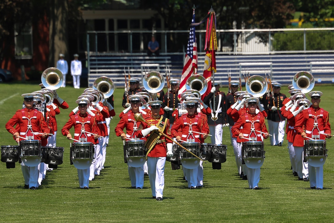 Marines with the U.S. Marine Corps Battle Color Detachment conduct pass in review during a Battle Color Ceremony as a part of the U.S. Naval Academy Commissioning Week at the USNA, Annapolis, MD, May 21, 2018. Parents, family members and guests of the First Class Midshipmen were invited to attend a series of events, including the BCD, in honor of the graduates. (Official Marine Corps photo by Cpl. Damon Mclean/Released)