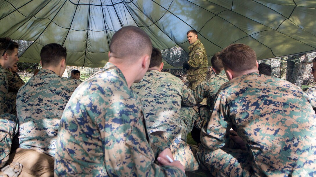 British Army Staff Sgt. Steven Kelly, survival instructor with 29th Commando Regiment, Artillery Battery, teaches Marines with 4th Air Naval Gunfire Liaison Company, Force Headquarters Group, necessary survival procedures should they be stuck in the wilderness for an extended time, in Durness, Scotland, April 26, 2018.