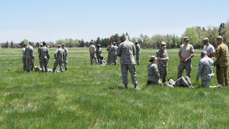 Airmen participated in the 90th Mission Support Group Warrior Day, receiving hands-on training following various scenarios for self-air buddy care, May 19, 2018, on F.E. Warren Air Force Base, Wyo. Following training, Airmen put their SABC skills to the test during a pre-planned scenario requiring medical evacuation procedures. The Warrior Day was an all-day training event to reinforce deployment preparedness, warrior ethos and a commitment to teamwork. (U.S. Air Force photo by Airman 1st Class Abbigayle Wagner)