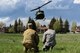 Staff Sgt. Andrew Leemasters, 790th Missile Maintenance Squadron decentralized material support technician, and Tech. Sgt. Christopher Rector, 37th Helicopter Squadron NCO in charge of plans and programs, call the helicopter into the landing zone during a 90th Mission Support Group Warrior Day, May 19, 2018, on F.E. Warren Air Force Base, Wyo. As part of the Warrior Day, Airmen participated in a casualty evacuation scenario, where they were able to practice self-aid buddy care concepts and medical evacuation procedures. The Warrior Day was an all-day training event to reinforce deployment preparedness, warrior ethos and a commitment to teamwork. (U.S. Air Force photo by Airman 1st Class Abbigayle Wagner)