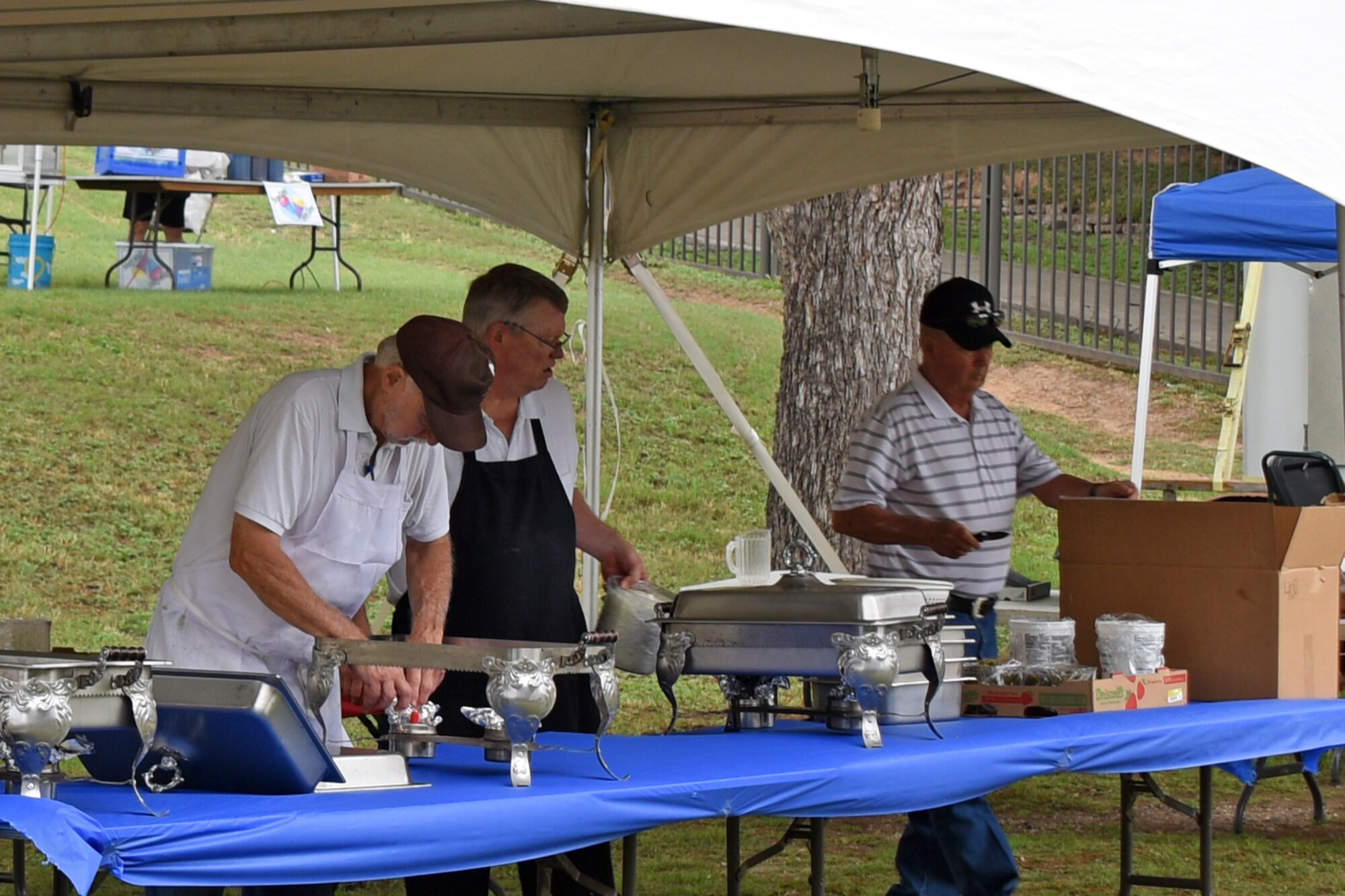 Volunteers prepare food for Goodfellow Appreciation Day at the Bill Aylor Sr. Memorial RiverStage in San Angelo, Texas, May 19, 2018. San Angelo thanked Goodfellow members and their families by providing free food and entertainment. (U.S. Air Force photo by Airman 1st Class Zachary Chapman/Released)