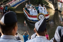 Members of the U.S. Navy take part in the Armed Forces River Parade May 19, 2018, in San Antonio, Texas. . The Armed Forces River Parade is dedicated to the men and women of the United States Armed Forces, and features 26 patriotically-decorated floats representing all branches of military service. The theme for this year was Military City USA, in honor of the rich military history in San Antonio as San Antonio celebrates the city's tricentennial. JBSA military ambassadors represent their services at JBSA events and foster a positive relationship between the military and San Antonio community. (U.S. Air Force photo by Senior Airman Stormy Archer)