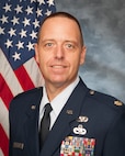 U.S. Air Force Maj. Scott Brochu, 158th Logistics Readiness Squadron operations officer, poses for an official photograph.