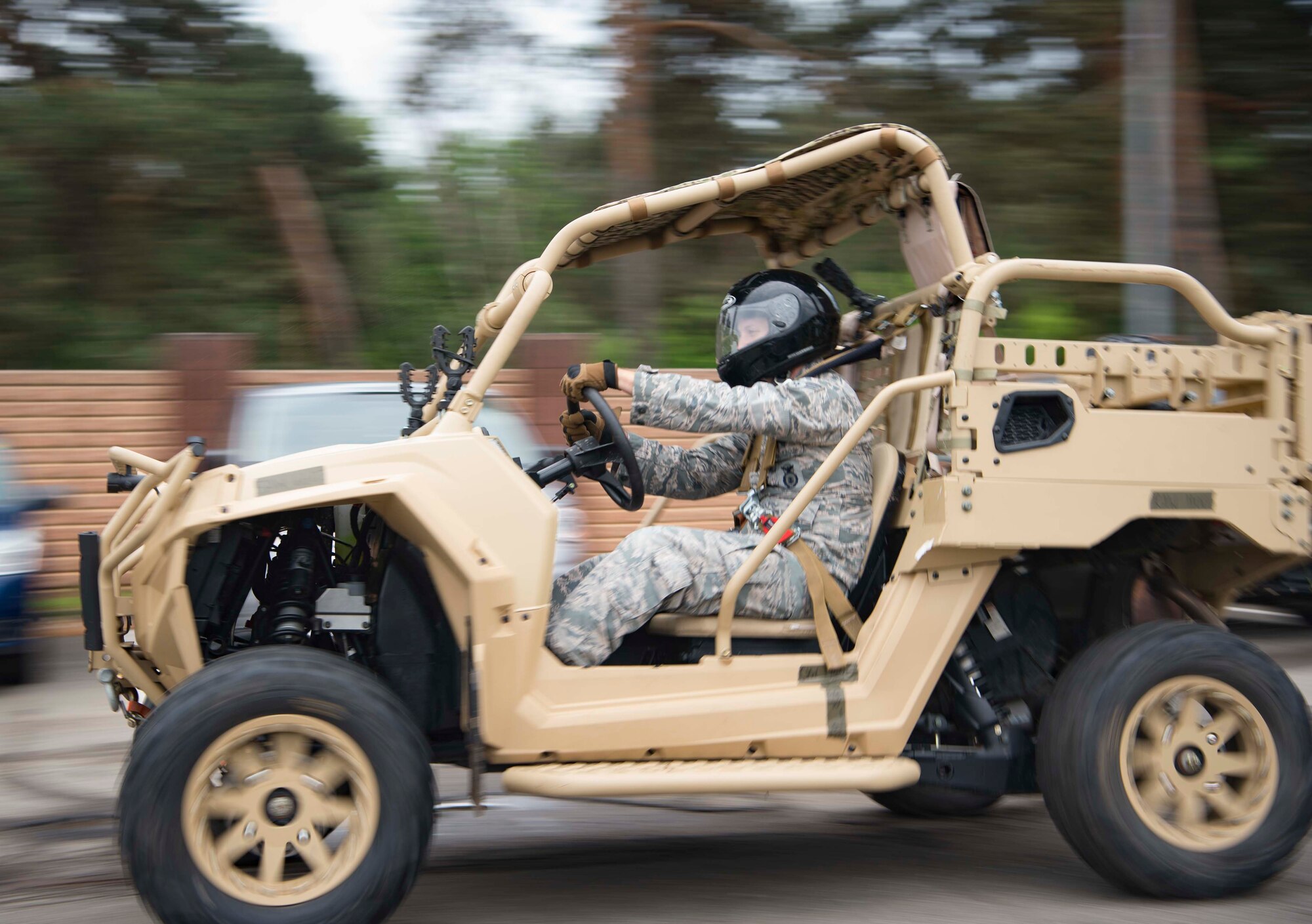 U.S. Air Force Senior Airman Ryan Daggett, 435th Security Forces Squadron contingency response team member, demonstrates the capabilities of a Razor all-terrain vehicle during Police Week 2018 on Ramstein Air Base, Germany, May 14, 2018. Eight law enforcement units invited the Kaiserslautern Military Community to experience various aspects of their professions, such as a military working dog demonstration, a simulated vehicle pursuit, and a weapons display. (U.S. Air Force photo by Senior Airman Elizabeth Baker)
