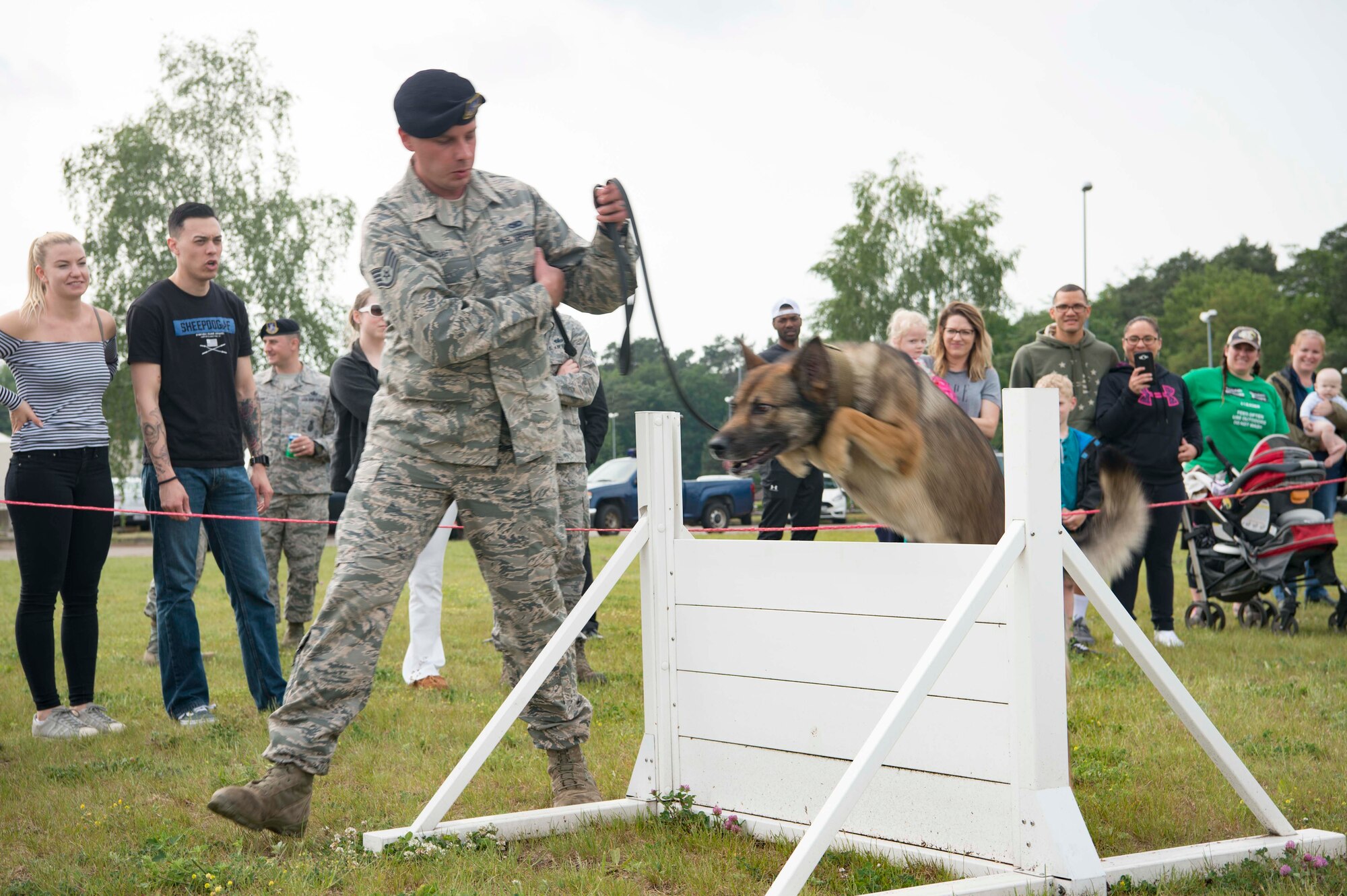 U.S. Air Force Staff Sgt. Andrew Kraft, 86th Security Forces Squadron military working dog handler, directs Sky, 86th SFS MWD, during Police Week 2018 on Ramstein Air Base, Germany 2018. The Police Week events involve the entire Kaiserslautern Military Community and build relationships with the general public. (U.S. Air Force photo by Senior Airman Elizabeth Baker)